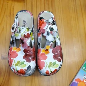 These are some Alegria clogs slip ons flowerd.
